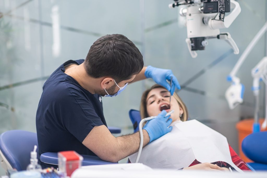 Dentist providing a routine checkup and dental cleaning